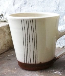 Retro terracotta mug with cream and brown stripes £12.50, Suzanne's pottery